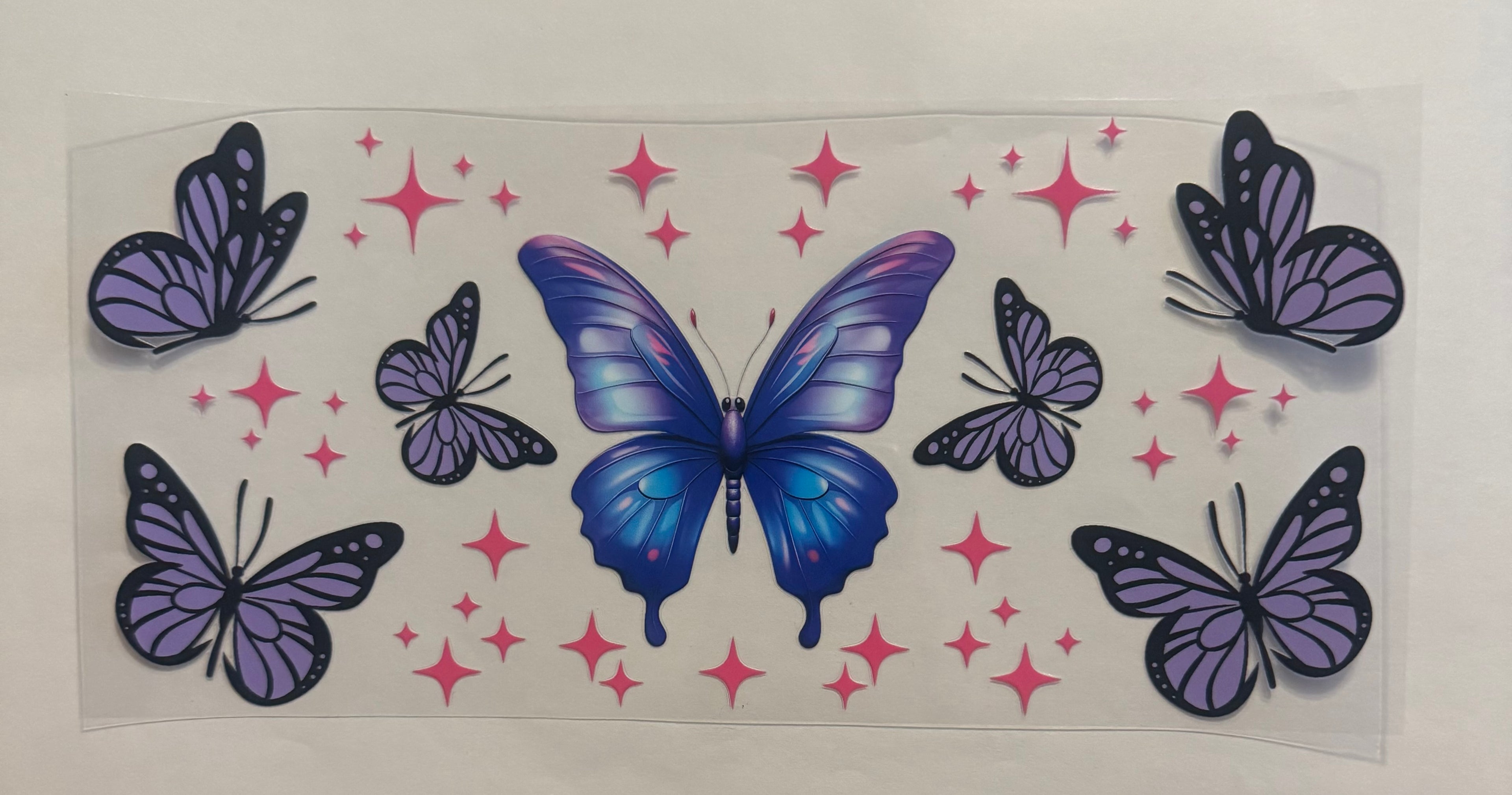 Purple butterfly with pink stars