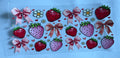 Red and pink strawberries with bows