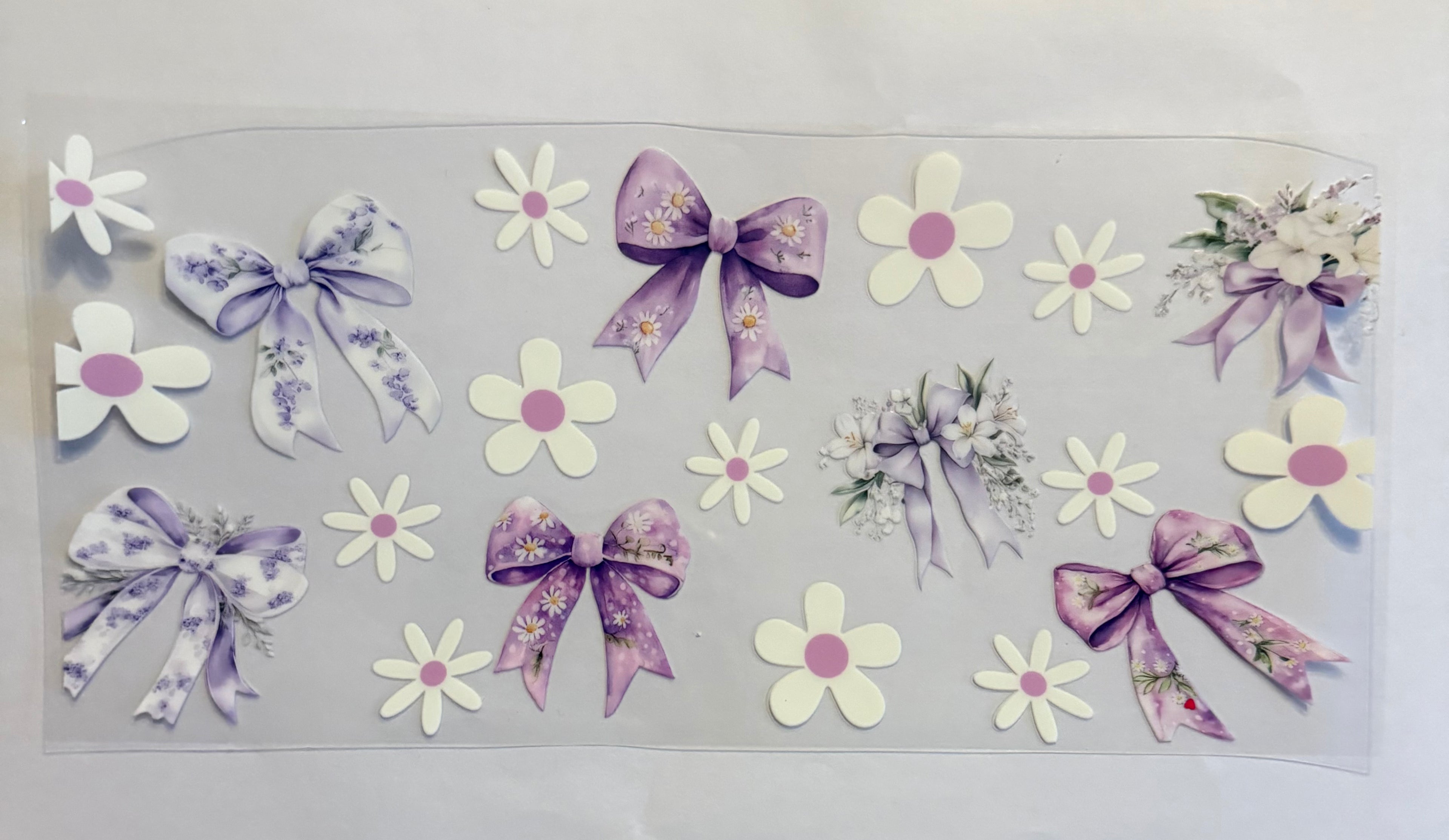 Purple and white bows with flowers