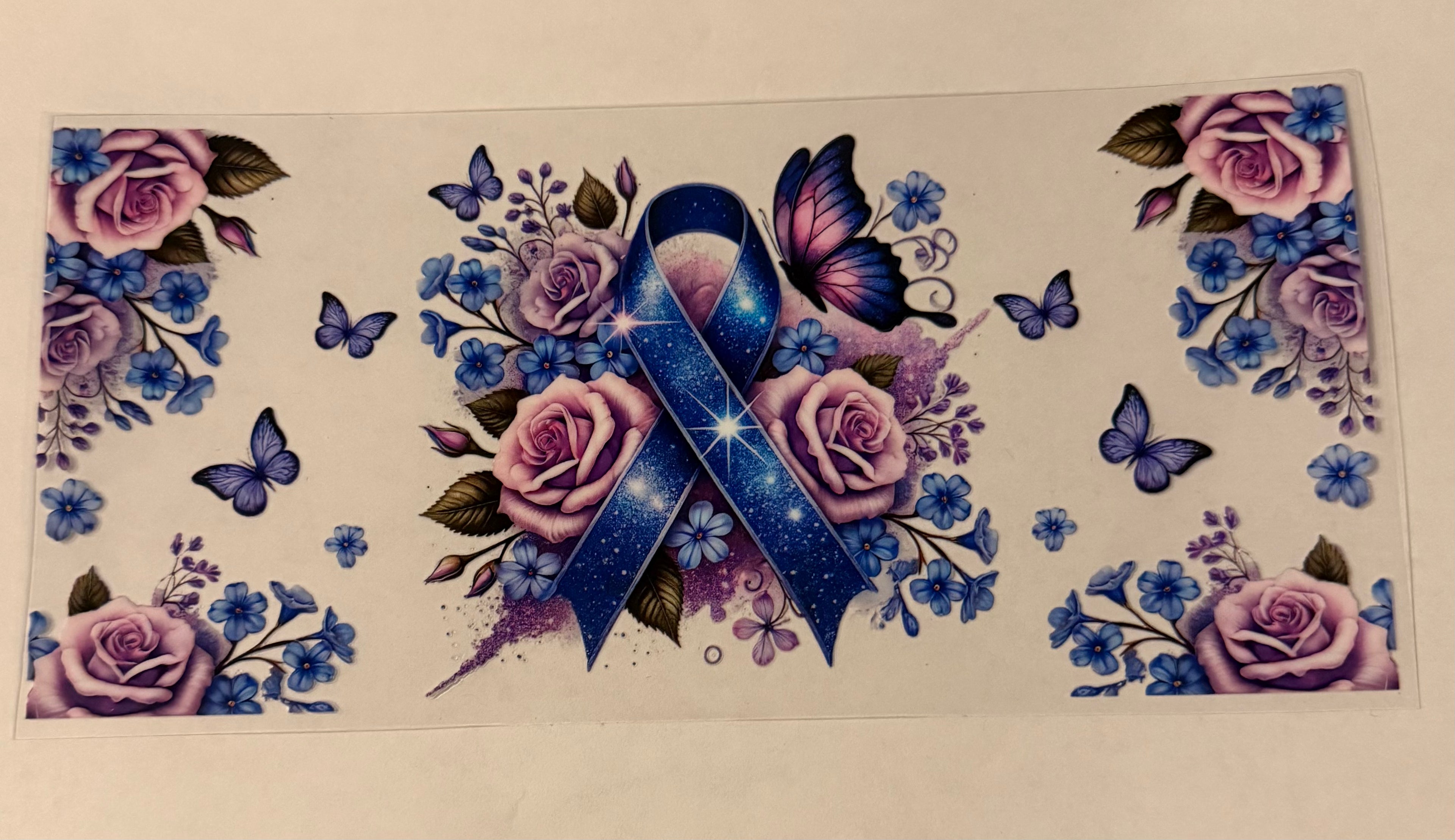 Blue ribbon with purple flowers