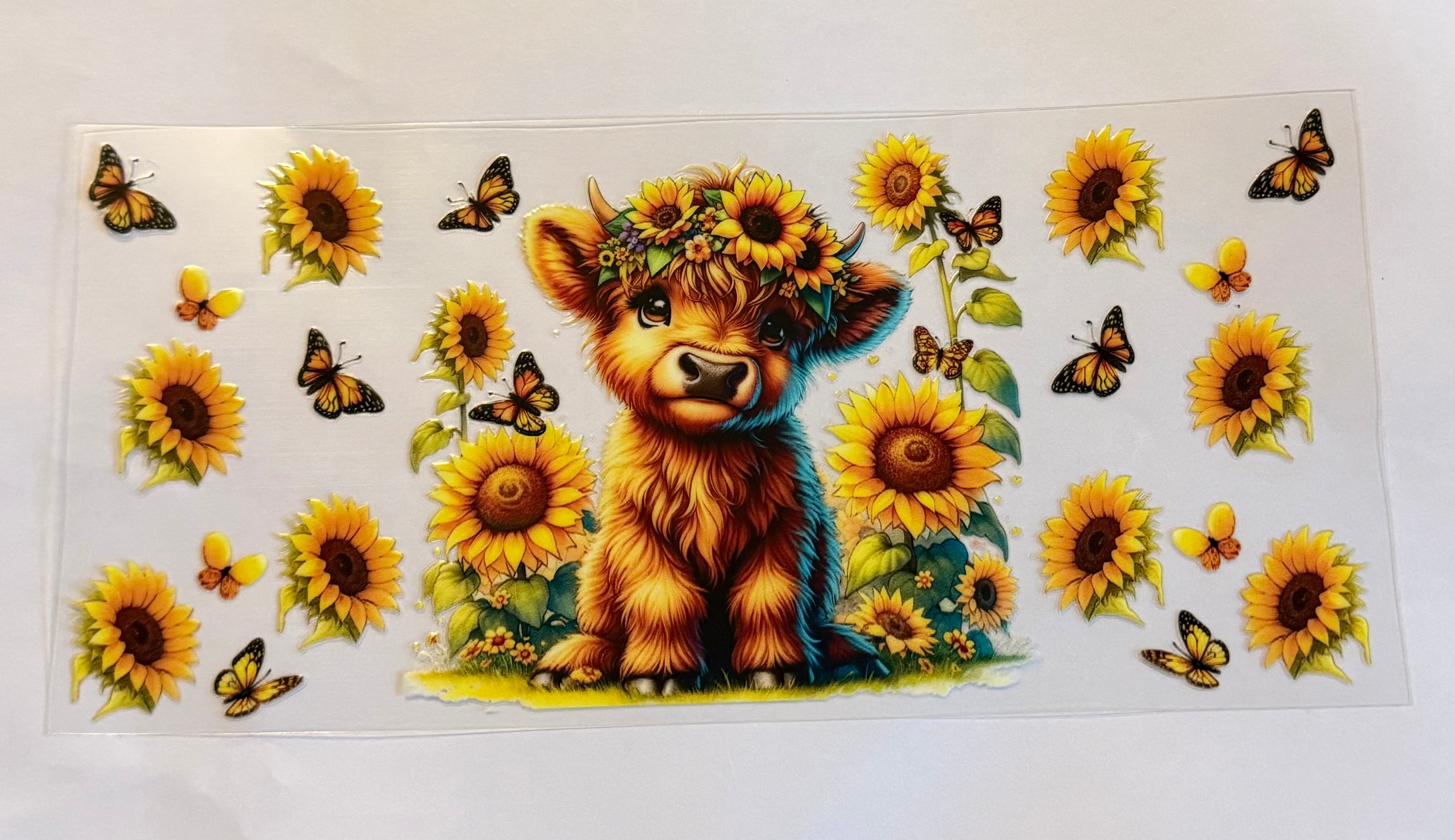 Cow with yellow sunflowers and butterflies