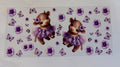 Cow in purple tutu with butterflies and flowers