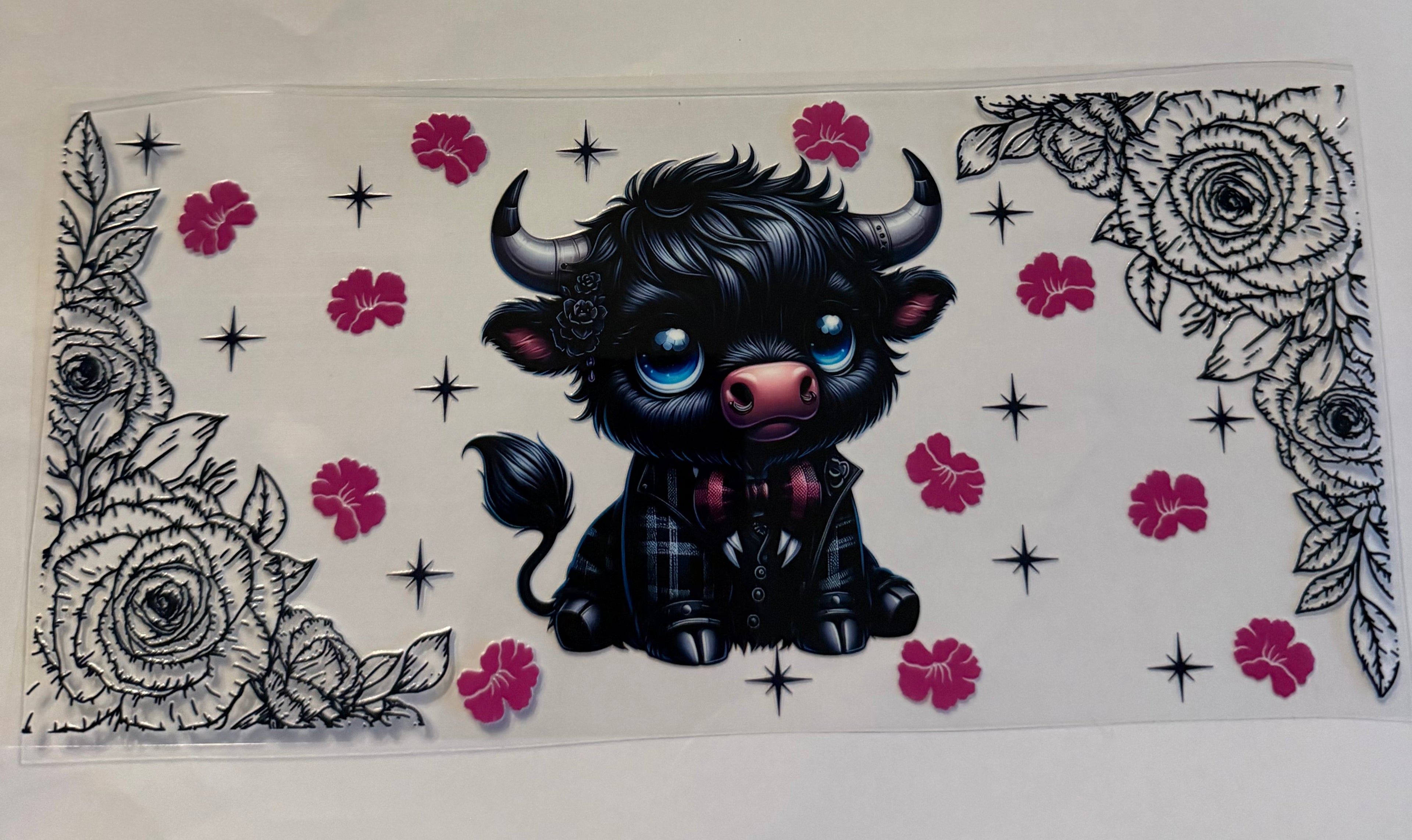 Black cow and flowers