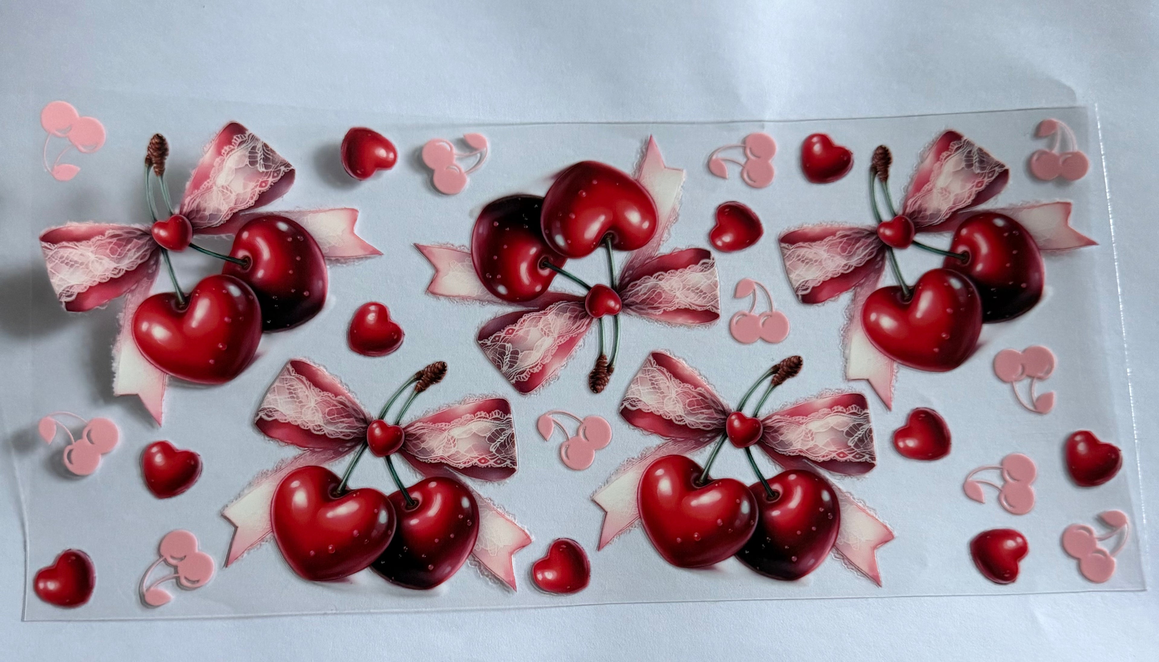 Cherries with bows and hearts