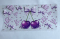 Purple cherries with bows