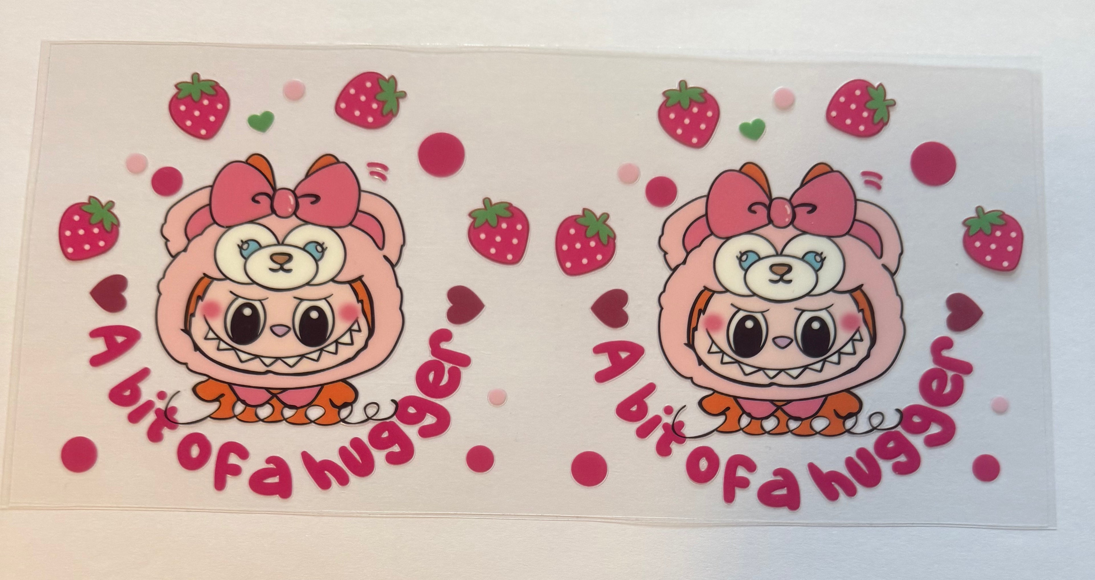 Orange Labubu in bear costume with strawberries
