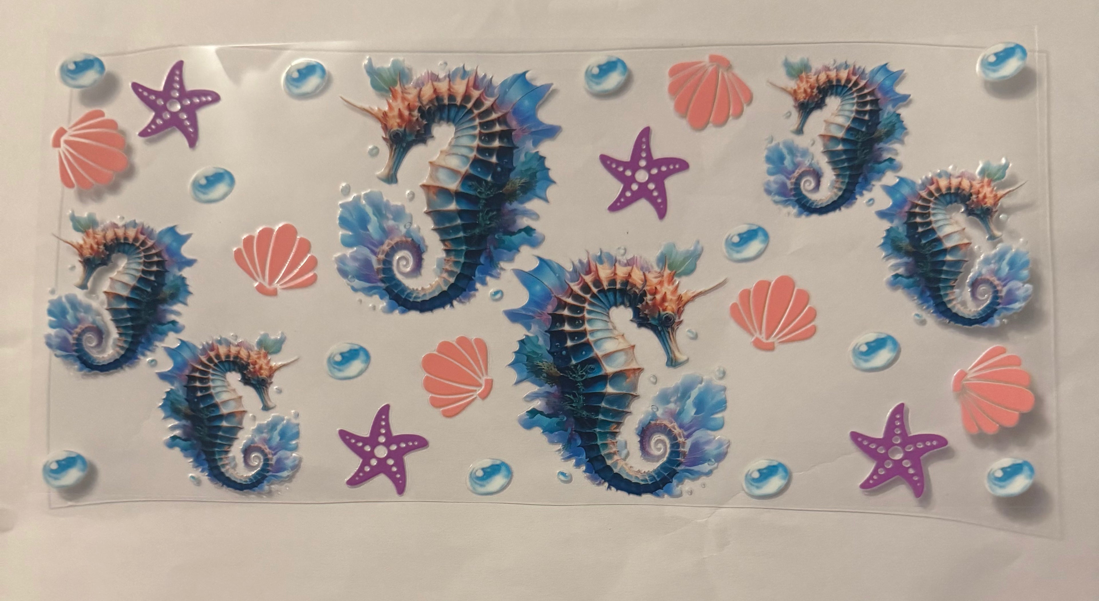 Sea horse with shell and starfish