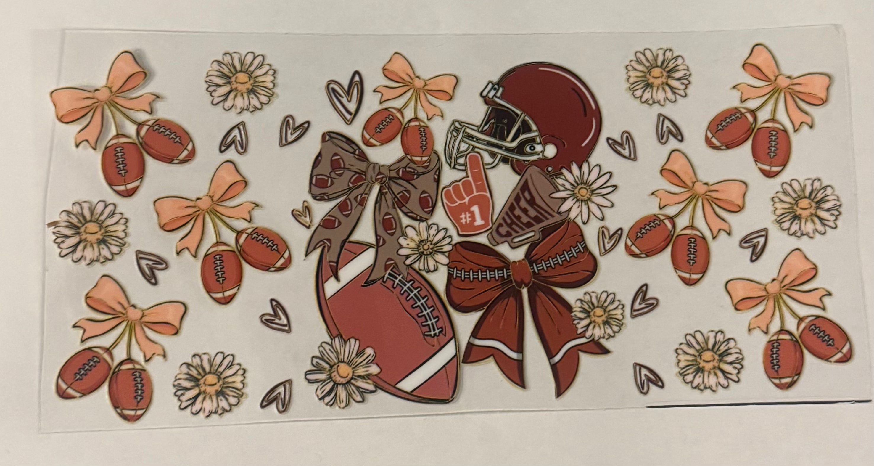 Football with bows and cherries
