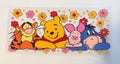 Winnie the Pooh characters with flowers